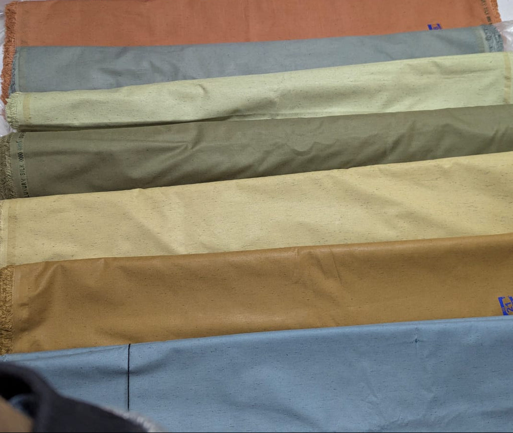 Fabric swatches in various colors displayed side by side.