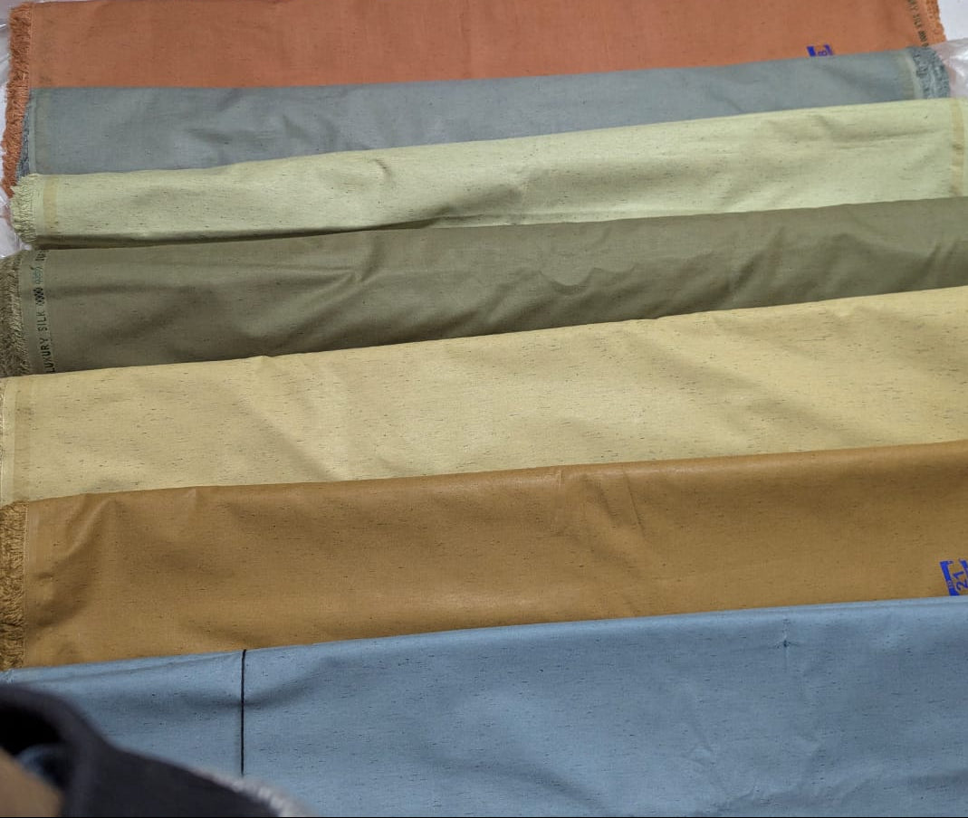 Fabric swatches in various colors displayed side by side.